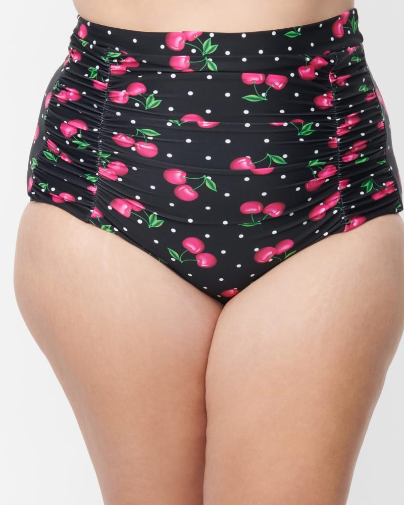 Side of a model wearing a size 2X/18 Unique Vintage Plus Size Black & Hot Pink Cherry Pin Dot Monroe Swim Bottom in Black & Hot Pink Cherry Pin Dot by Unique Vintage. | dia_product_style_image_id:269512